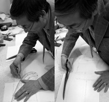 Master Tailor Jin Lee personally drafting a custom garment pattern by hand at the worktable